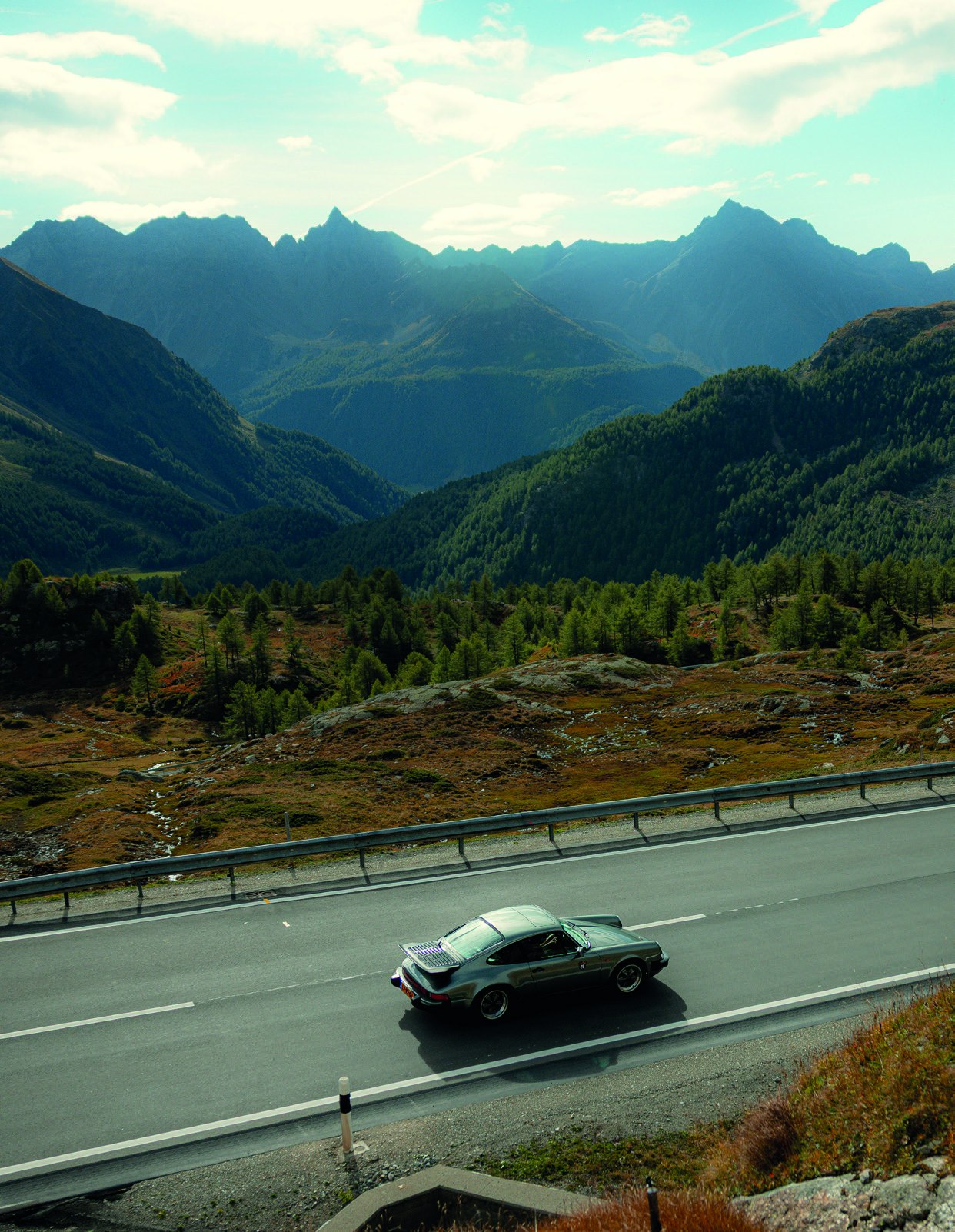 Wilco van Huizen's classic Porsche 911 on a mountain road during Alp Attack.